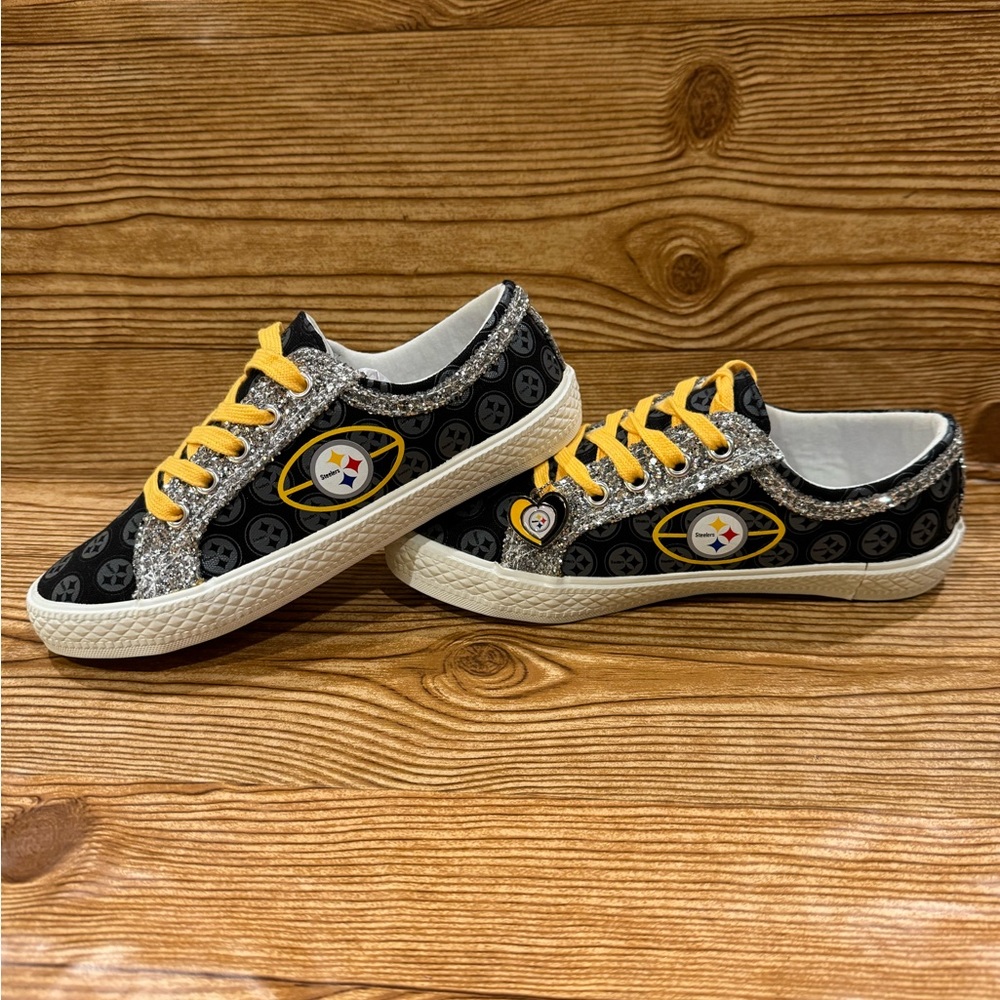 Ladies size 5 Pittsburg Steelers shoes with glitter trim. Bradford Exchange